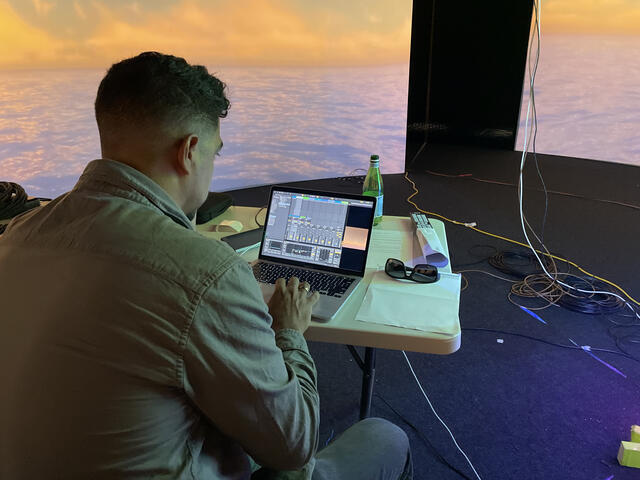 A man working projections on a laptop