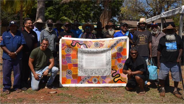 Group of people with the Uluru Statement of the Heart canvas
