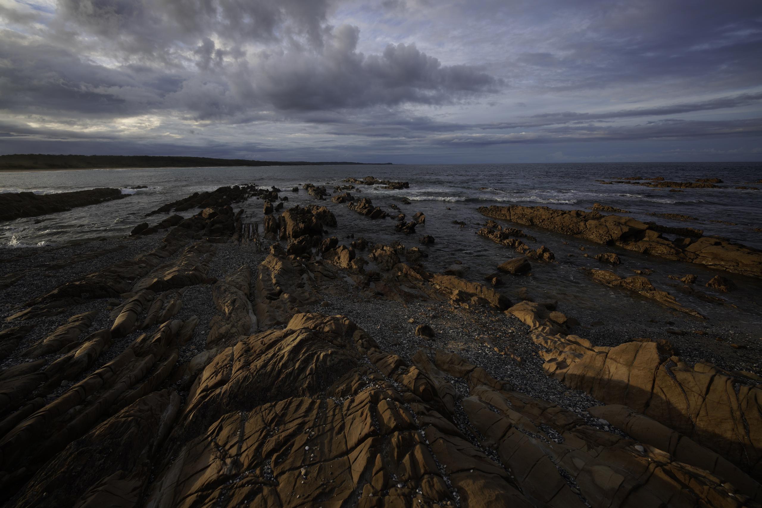 Low tide rock pools on a headland